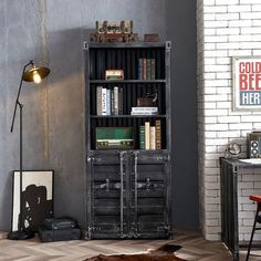 a room with a book shelf and some books on it in front of a brick wall