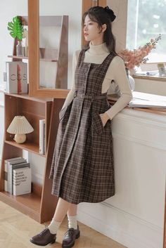 Our Sorrell Dark Academia Plaid Wool Pinafore Dress is perfect for stepping back into the golden age of learning and literature. Crafted with a sumptuous wool blend, this elegant pinafore dress is designed with a timeless plaid pattern and a chic, adjustable belt, creating a distinctive academia look perfect for enchanting dark academia evenings. (Top not included) Dark Academia Outfits, Dark Academia Outfit, Academia Outfits, Academia Style, Cottagecore Outfits, Academia Fashion, Cottagecore Fashion, Outfit Pink, Sweater Outfit