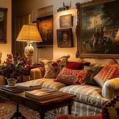 a living room filled with furniture and paintings on the wall