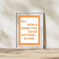 an orange and white poster with the words in a world where you can be anything, be kind