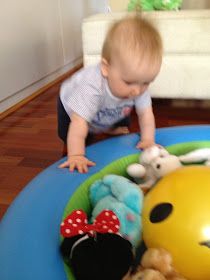 a baby playing with toys on the floor