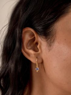 T A N Z A N I T E ∙ E A R R I N G S These earrings are crafted with 24k gold vermeil over 925 sterling silver. Each earring features an oval-cut tanzanite gemstone set in a sleek bezel setting, creating a stunning yet minimalist design. The vibrant blue-violet tones of the tanzanite catch the light beautifully, adding a touch of sophistication to any outfit.  This earring is also available in Peridot, Garnet, Amethyst, Citrine, Blue Topaz and Iolite Gemstones. Please write to us for customizations.  * Material: 24K Gold Vermeil on 925 Sterling Silver - Hypo-Allergenic and Nickel Free * Finish: 24K Gold Vermeil on 925 Sterling Silver | Also available in solid 925 Sterling Silver * Featuring 2 Pieces of 4*5 MM Oval natural Tanzanite gemstone. * Total Stone Weight: 0.65 Carats O T H E R ∙ I N Handcrafted Silver Jewelry, Tanzanite Earrings, Bleu Violet, Tanzanite Gemstone, Natural Stone Jewelry, Jewelry Pins, Handmade Jewelry Gift, Blue Violet, Drop Earring