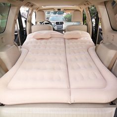 an inflatable mattress is placed on the back of a vehicle