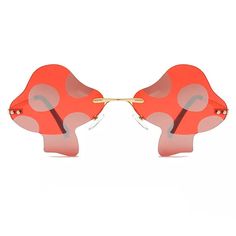 a pair of sunglasses that are shaped like mushrooms with red and pink lenses on them