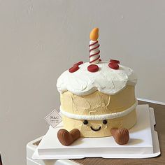 a birthday cake sitting on top of a white plate