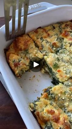 a casserole dish with broccoli and cheese on it is being eaten by a fork