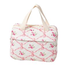 a white bag with pink flowers on the front and bottom, sitting against a white background