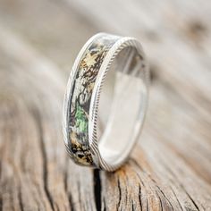 a wedding band that has been made to look like it is decorated with flowers and leaves