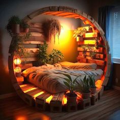 a bed made out of wooden pallets with plants in the middle and lights on