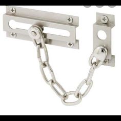 two metal chains are attached to the side of a wall mounted door hinges