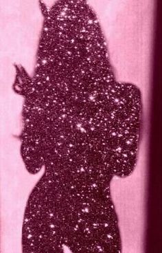 the silhouette of a woman with horns on her head is shown against a pink background