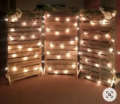 three wooden pallets with lights on them