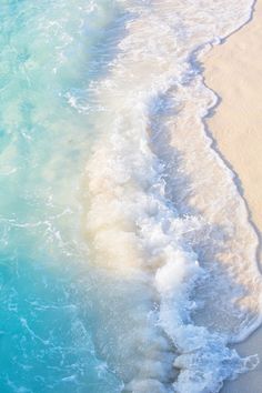 an ocean beach with waves coming in to the shore