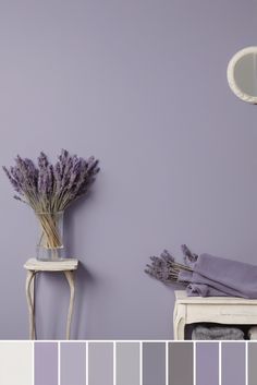 there is a vase with lavender flowers in front of the purple wall color palettes