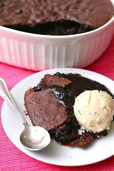 a white plate topped with brownie and ice cream next to a bowl of pudding