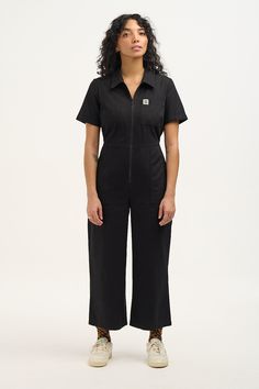 Ragan In Our Zip Front Short Sleeve Jumpsuit With A Wide Cropped Leg And Elasticated Back For Comfort Available Here In Black! Our Fit Short Sleeve With Fixed Turn Up Fitted Bodice With Back Elasticated Waist Channel Closer Fitting On The Hips With Wide Crop Length Leg Standard Collar With A Zip Opening At Front Chest Pocket, Deep Hip Pockets And Back Patch Pockets The Fabric 100% Cotton Twill - Made From Gots Certified Organic Cotton The Fabric Is Soft, Breathable And Durable Yak Care Machine W Lucy And Yak, Short Sleeve Jumpsuit, Dungarees Shorts, Comfy Clothing, Fitted Jumpsuit, Cotton Jumpsuit, Turn Up, Back Patch, Tee Dress