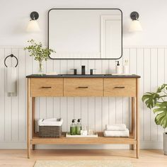 a bathroom with a wooden vanity and mirror