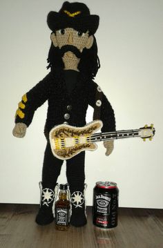 a stuffed animal with a guitar and beer