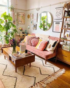 a living room filled with furniture and lots of plants