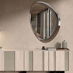 Ascot is a designer mirror whose shape is reminiscent of an eye casting its gaze on the environment, reflecting its perspective in the surrounding space. The design is irregular, but the precise lines and curved are so clearly visible. The Ascot mirror is made up of tow distinct elements. The central mirror section is smooth and well-defined, slightly higher than the outer frame. The outer edge, in fact is slightly concave, with a more pronounced curvature on one side. On this side in particular, the outer surface does not reflect the environment sharply. Rather, by harnessing the brightness of its surroundings, it reflects curved streaks that act as a decorative frame, with a liquid, shifting optical effect. The result is a modern mirror with a soft, slowing shape that seems to want to em Kitchen Staging, Designer Mirror, Lounge Interiors, Closet Collection, Vintage Sculpture, Interior Design Consultation, Decorative Frame, Guest Chair, Wall Ceiling Lights