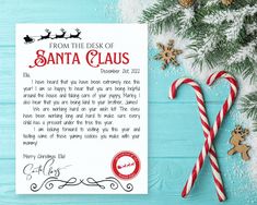 a letter from santa claus to his daughter on christmas day with candy canes and decorations