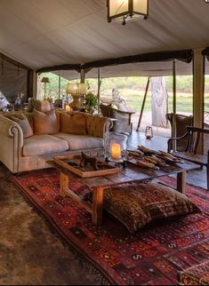 a living room filled with furniture under a tent