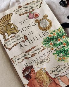 the song of achilles is written on a book with pictures of women and trees