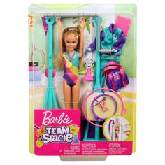 the barbie doll is holding her hairbrush and other items in its package for sale