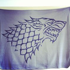 a game of thrones flag with the starker's head drawn on it