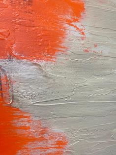 an orange and grey painting with white lines