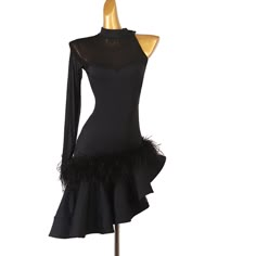 a mannequin wearing a black dress with feathers on it