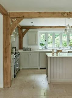 a large kitchen with an island in the middle