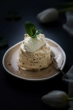 a small dessert on a plate with a spoon