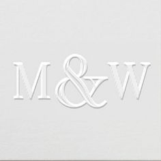 the letter m and w is cut out from paper with white lettering on it's side