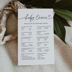 a baby shower game is shown on top of a piece of paper next to a plant