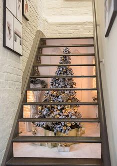 there is a christmas tree on the stairs