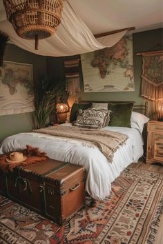 a bedroom with a bed, luggage and pictures on the wall