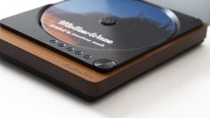 a cd player sitting on top of a wooden case