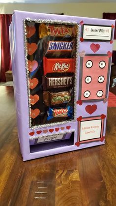 a candy machine made to look like it is for someone's valentines day