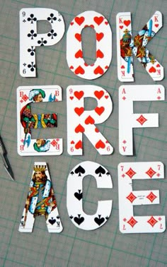 some playing cards and scissors are laying on a table with the words poker ace spelled out