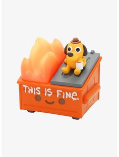 an orange toy with a dog sitting on it's back and the words, this is fine