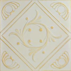 an ornate white and gold tile design