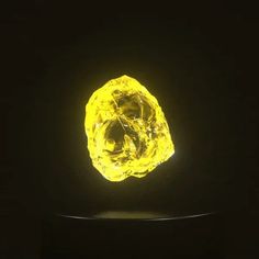 a yellow diamond is glowing in the dark