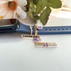 BTS inspired 'i purple you' watch band charms.☁︎Compatible with;Our watch band jewellery is designed to fit into Apple watch bands, Samsung Galaxy watch straps, Google pixels and more!☁︎Details;- High quality copper (Gold plated)- Hard enamel- Reference band sizes used in image - 38mm to 48mm. While I cannot guarantee that they will fit into every brand, they will fit into most watch bands! Bts Watch, Watch Band Charms, Watch Charms, Business Essentials, Samsung Galaxy Watch, Band Jewelry, Watch Straps, Apple Watch Bands, Watch Strap