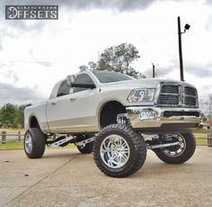 a large white truck parked on top of a parking lot