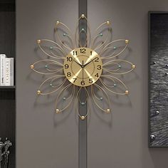 a clock that is on the side of a wall in a room with bookshelves