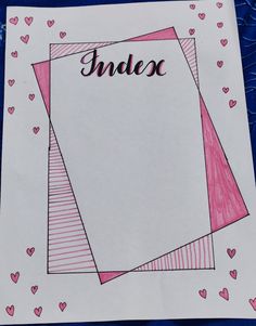 a piece of paper with the word indec written on it and hearts around it