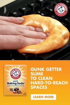 an advertisement for baking soda with a hand holding a doughnut in front of a computer keyboard