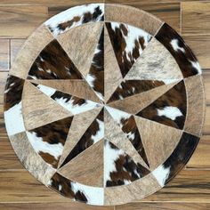 an animal print rug on top of a wooden floor