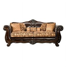 an ornately decorated couch with pillows on it's back end and armrests